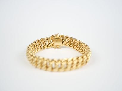 A striking 18K yellow gold (750‰) bracelet...