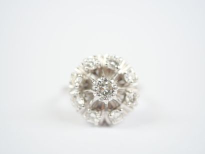 18K white gold (750‰) or platinum ring featuring...
