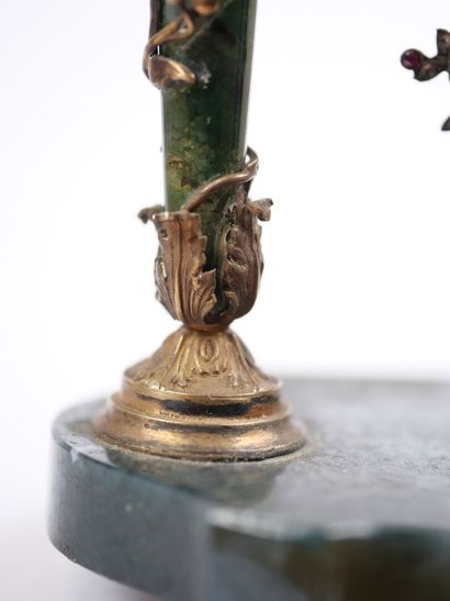 A column-style table clock with scalloped...