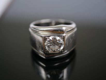 A striking platinum ring featuring a half-size...