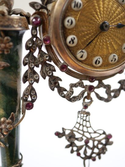 A column-style table clock with scalloped...