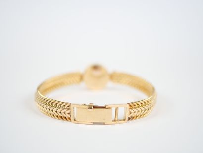 OMEGA. 
Ladies' watch with a round case and...