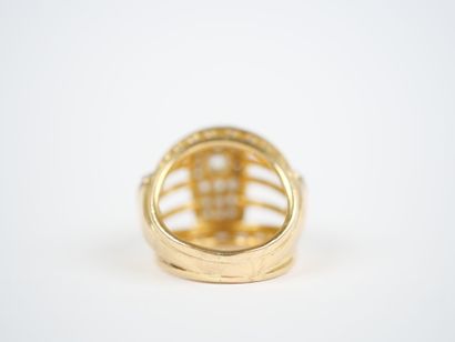 A large openwork dome ring in 18K yellow...
