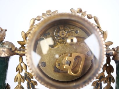 A column-style table clock with scalloped...