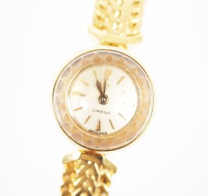 OMEGA. 
Ladies' watch with a round case and...