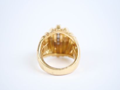 A large dome-shaped ring in 18K yellow gold...