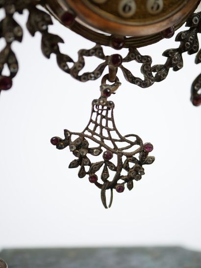 A column-style table clock with scalloped...