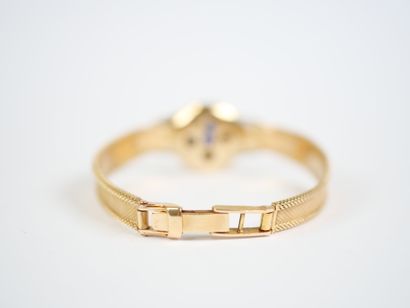 An 18K (750‰) yellow and white gold ribbon-link...