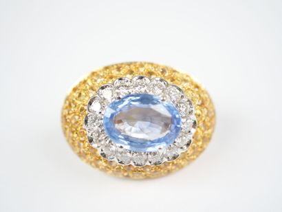 A striking pair of oval ear clips in 18K...