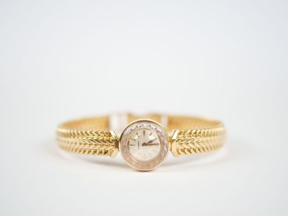 OMEGA. 
Ladies' watch with a round case and...