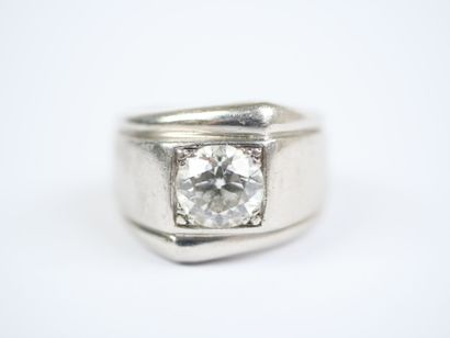 A striking platinum ring featuring a half-size...