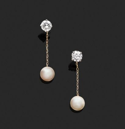 A pair of earrings in white gold and 18K...