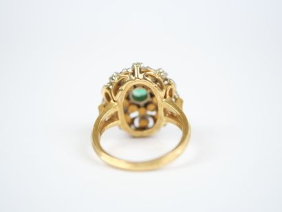 An 18K (750‰) yellow and white gold ring...