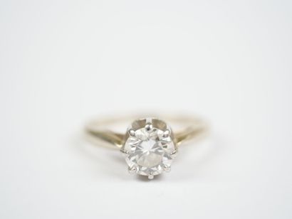 18K white gold (750‰) and platinum solitaire...