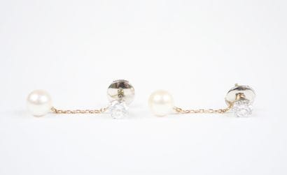 A pair of earrings in white gold and 18K...