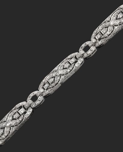 18K white gold link bracelet (750‰) and platinum...