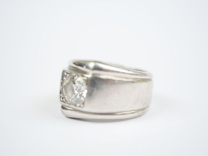 A striking platinum ring featuring a half-size...