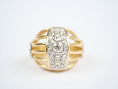 A large openwork dome ring in 18K yellow...