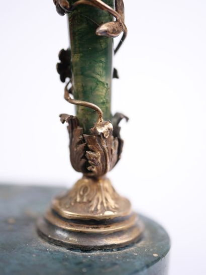 A column-style table clock with scalloped...