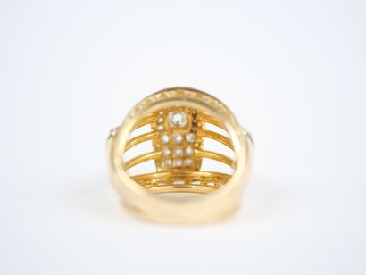 A large openwork dome ring in 18K yellow...