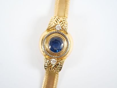 An 18K (750‰) yellow and white gold ribbon-link...