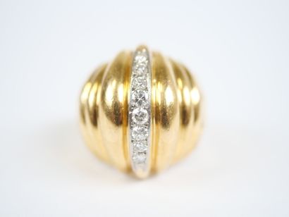 A large dome-shaped ring in 18K yellow gold...