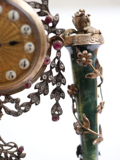 A column-style table clock with scalloped...