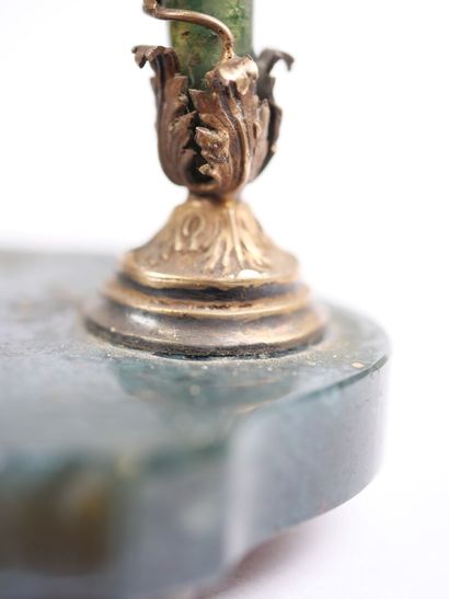 A column-style table clock with scalloped...