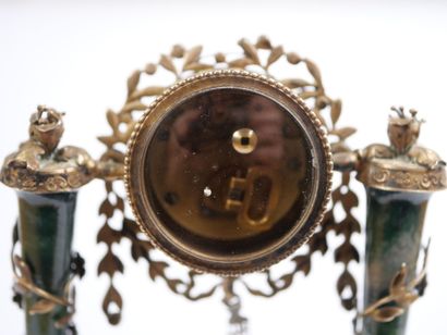 A column-style table clock with scalloped...