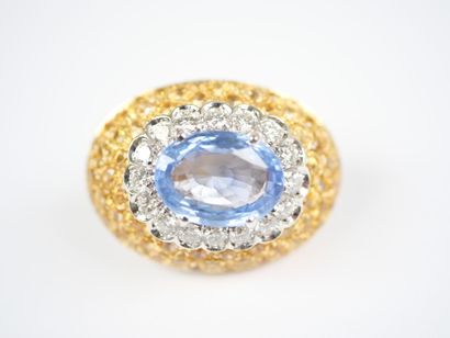 A striking pair of oval ear clips in 18K...