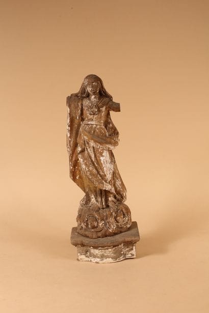 Virgin on clouds 
Carved wood and traces...