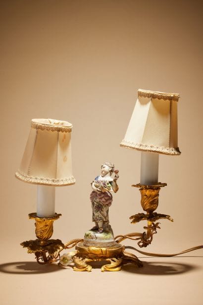 Candlestick in gilt bronze with two arms...