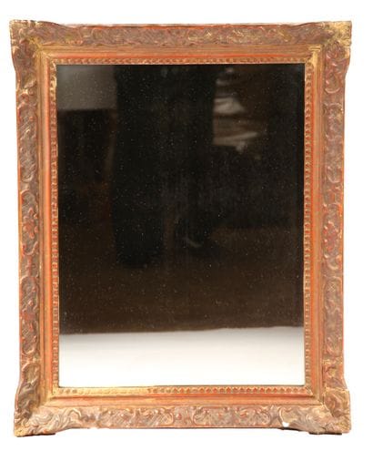 Wood and gilded stucco mirror decorated with...
