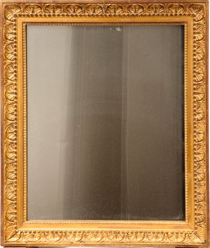 Wood and gilded stucco mirror decorated with...