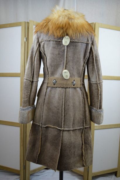 DOLCE GABBANA

Manteau long en peau lainé...
