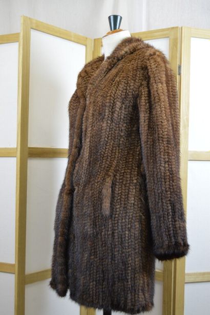 LEDERER

Manteau à capuche en vison tricoté...