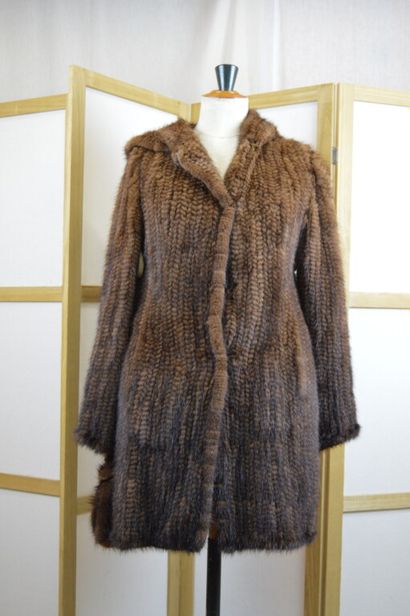 LEDERER

Manteau à capuche en vison tricoté...