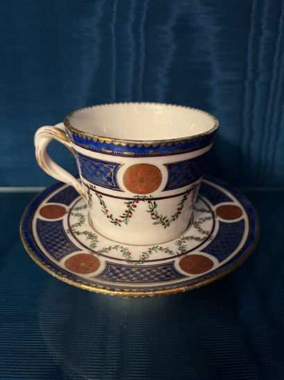SÈVRES.
Sunken porcelain goblet and saucer...