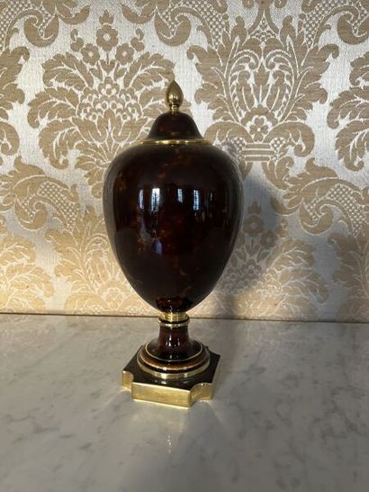 SÈVRES.
Porcelain ovoid vase and cover, painted...