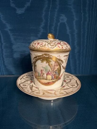 PARIS.
Porcelain trembleuse covered cup and...