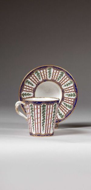 SÈVRES. 
Sunken porcelain goblet and saucer...