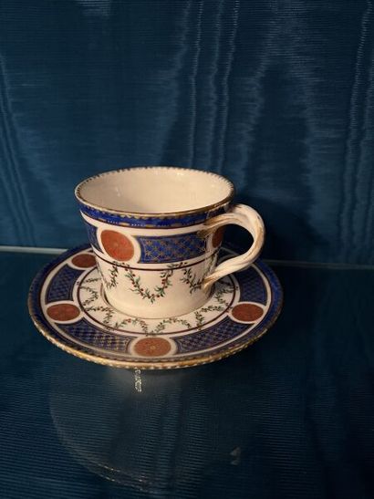 SÈVRES.
Sunken porcelain goblet and saucer...