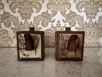 CHINA.
Pair of small teapots in brown tinted...