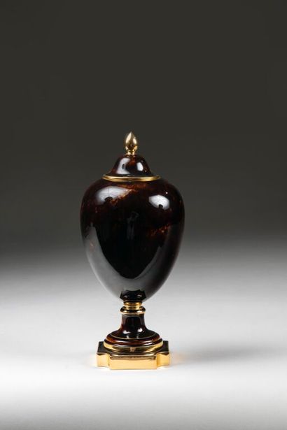 SÈVRES.
Porcelain ovoid vase and cover, painted...