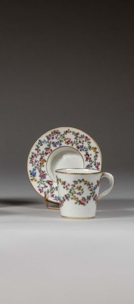 SÈVRES.
Sunken porcelain goblet and saucer...