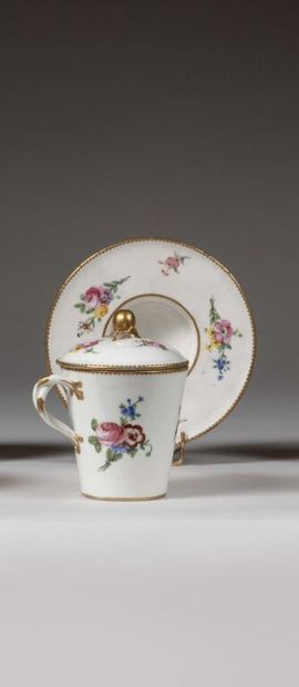 SÈVRES.
Sunken porcelain goblet and saucer...