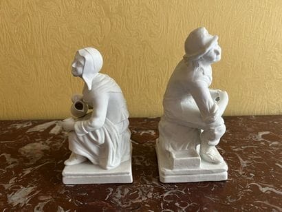 Two porcelain cookie pendant groups depicting...