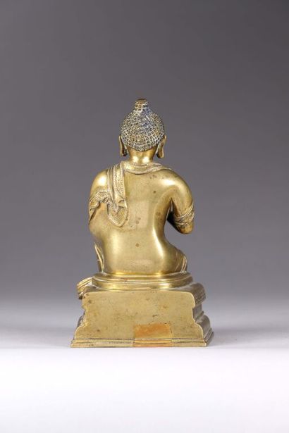 TIBET.
Statuette de bouddha en bronze doré...