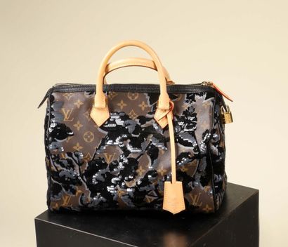 * LOUIS VUITTON.
Sac à main Speedy, rare...