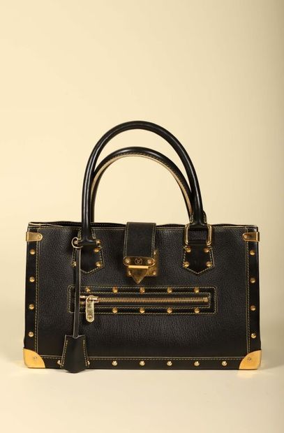 * LOUIS VUITTON.
Sac à main modèle Suhali...
